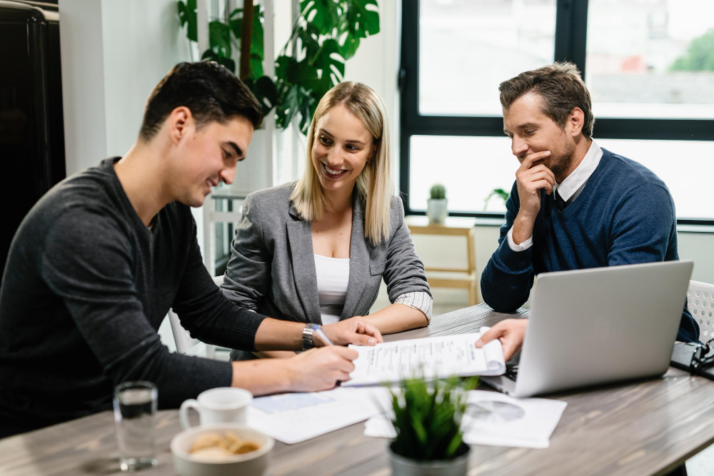A King Capital advisory team reviewing a transaction file with a client